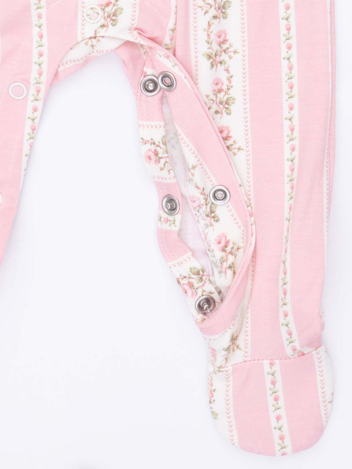 Pink floral-patterned baby onesie with snaps and striped design. Ideal for infants and toddlers.