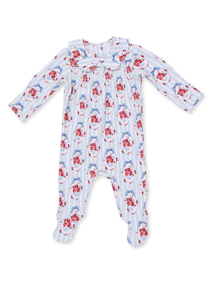 Floral-patterned baby romper with long sleeves and a collared neckline on a light blue background.