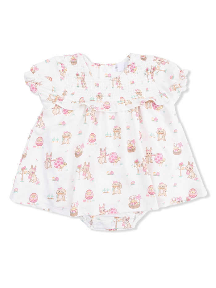 White baby dress with pastel animal prints and floral designs, featuring short ruffled sleeves and a snap bottom.