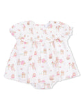 White baby dress with pastel animal prints and floral designs, featuring short ruffled sleeves and a snap bottom.