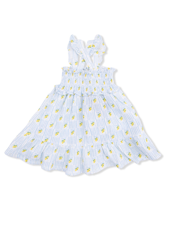 Blue dress with lemon print and frill at the bottom, featuring cross-back straps. Perfect for summer.