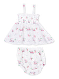 Girls' dress and bloomers set with playful golf-themed prints in pastel colors. Adjustable straps and soft fabric.