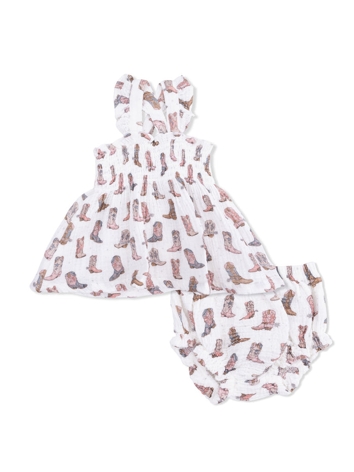 Children's two-piece outfit featuring a dress and matching bloomers with a cowboy boot print on a white background.