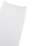 White fabric with a navy blue polka dot pattern, folded at an angle.