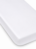 White mattress corner on a light background, featuring a smooth, clean finish. Ideal for a minimalist aesthetic.