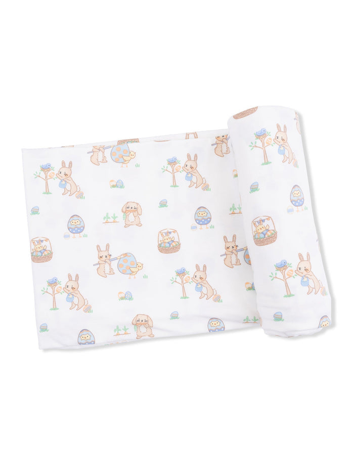 Patterned fabric with cute cartoon animals, including rabbits and chicks, in a playful spring design.