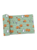Green fabric featuring cartoonish footballs and playful characters on a football field design.