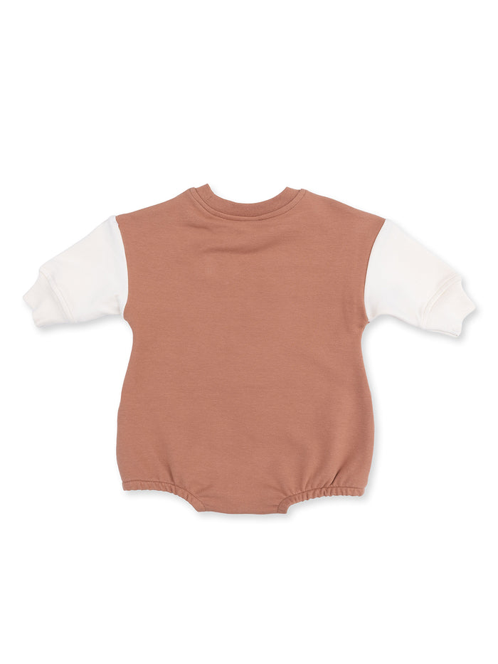 Back view of a toddler's romper, featuring a brown body and white sleeves. Ideal for casual wear.