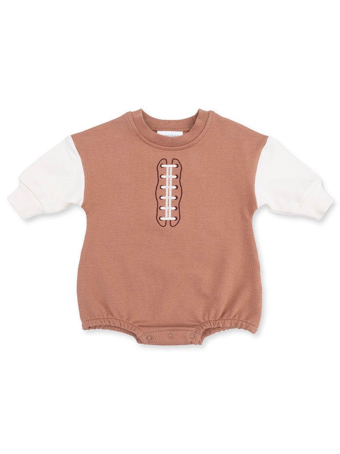 Brown baby onesie with white sleeves and football stitching design on the front. Perfect for sports fans.