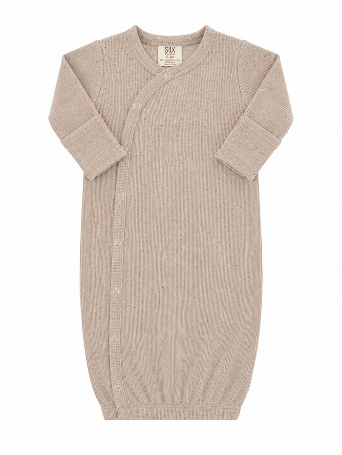 Light beige newborn sleep sack with ribbed texture and snap buttons, designed for comfort and ease of use.
