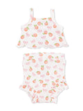 Two-piece kids' outfit featuring a peach and bow pattern on a white background. Ideal for warm weather.