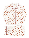 Patterned white pajama set featuring red trim and floral designs, laid flat on a white background.