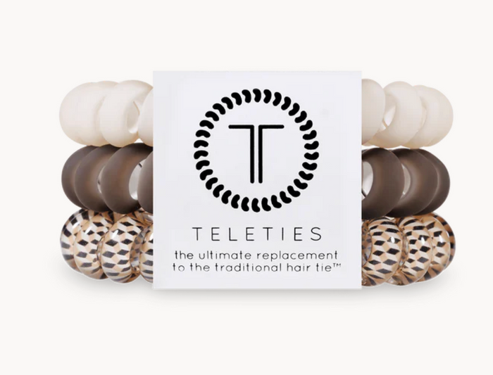 A pack of three Teleties hair ties with a logo, colors cream, brown and tan pattern