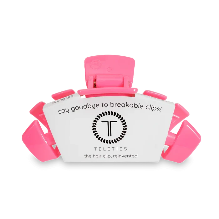 Pink hair clip with a label 'Teleties' on a white background