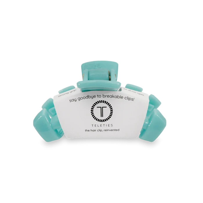 Teal hair clip with a label 'Teleties' on a white background