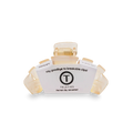 Cream hair clip with a label 'Teleties' on a white background
