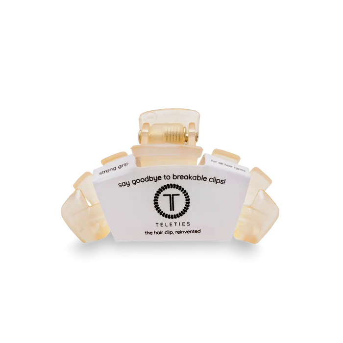 Cream hair clip with a label 'Teleties' on a white background