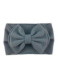 Gray fabric headband with a large, textured bow on the front.