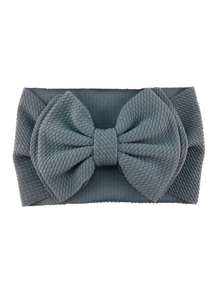 Gray fabric headband with a large, textured bow on the front.