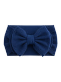 Navy blue fabric headband with a large textured bow in the center.