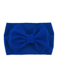 Bright blue headband with a large textured bow at the front.