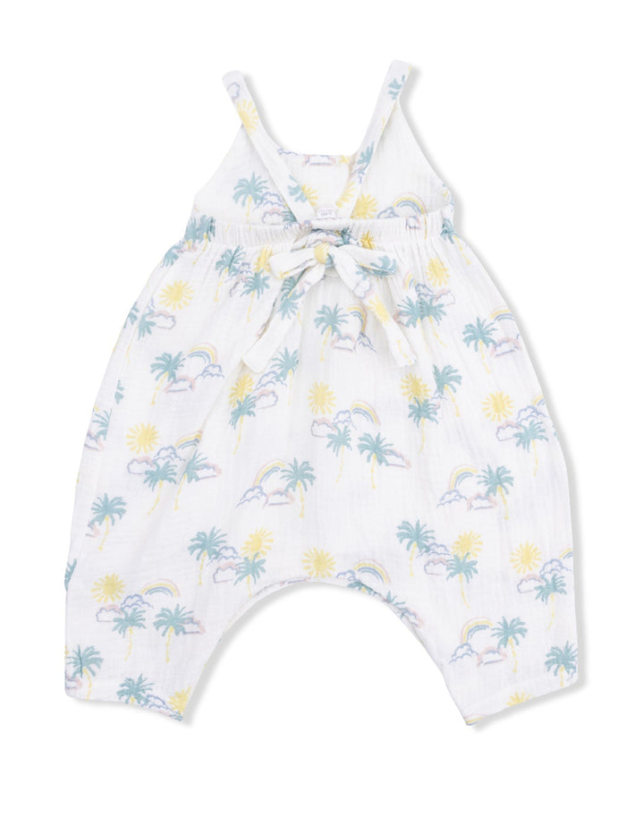 White sleeveless romper with pastel sun, rainbow, and palm tree print, featuring a tied waist detail.