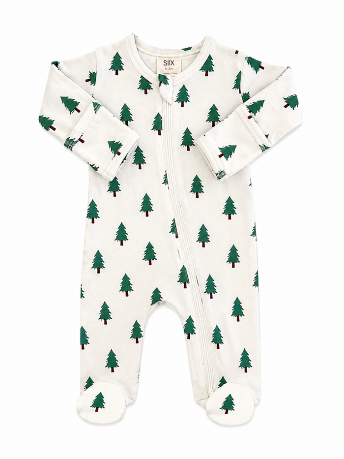 White baby onesie with green Christmas tree print and footed bottoms, featuring a front zipper closure.
