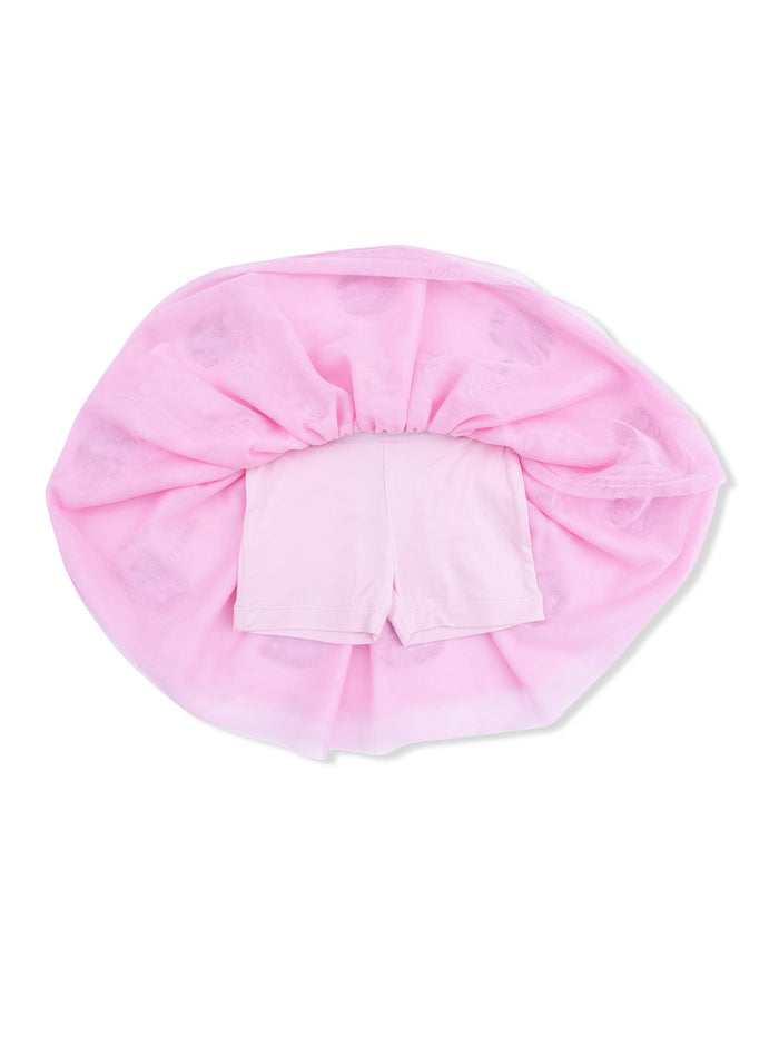 Pink tulle skirt with attached shorts, arranged in a circular shape on a white background.