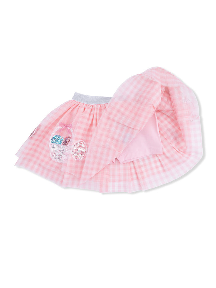 Pink gingham skirt with colorful decorations, including a matching top, perfect for young girls' outfits.