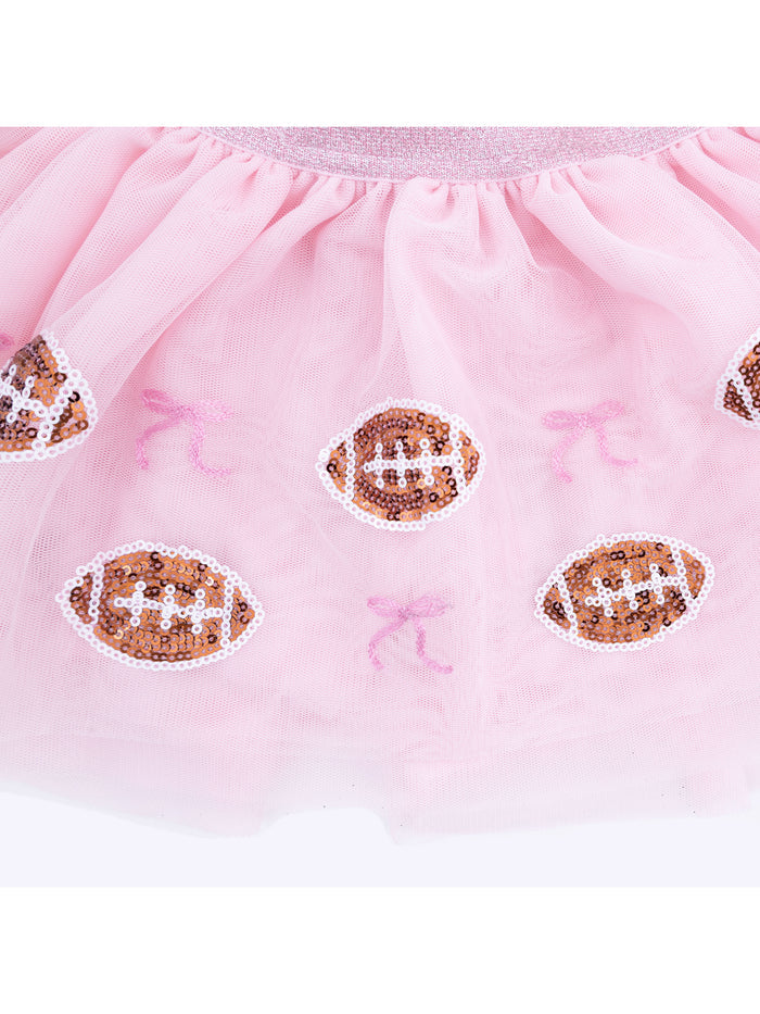 Pink tulle tutu with sequin football appliques and pink bows. Perfect for playful and themed outfits.