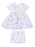 Children's dress and shorts set featuring colorful sea-themed patterns, including starfish and seashells.