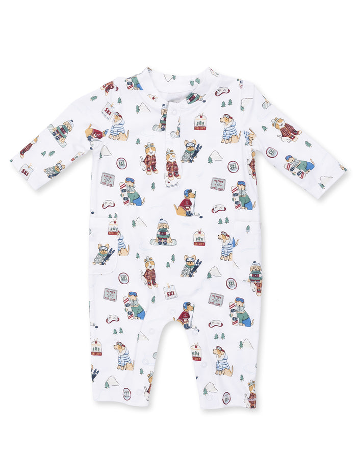 White infant onesie with playful dog skiing illustrations and winter-themed designs.
