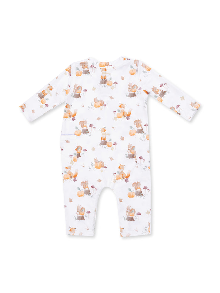 Back view of a toddler onesie with a playful woodland animals print, featuring pumpkins and fall leaves.