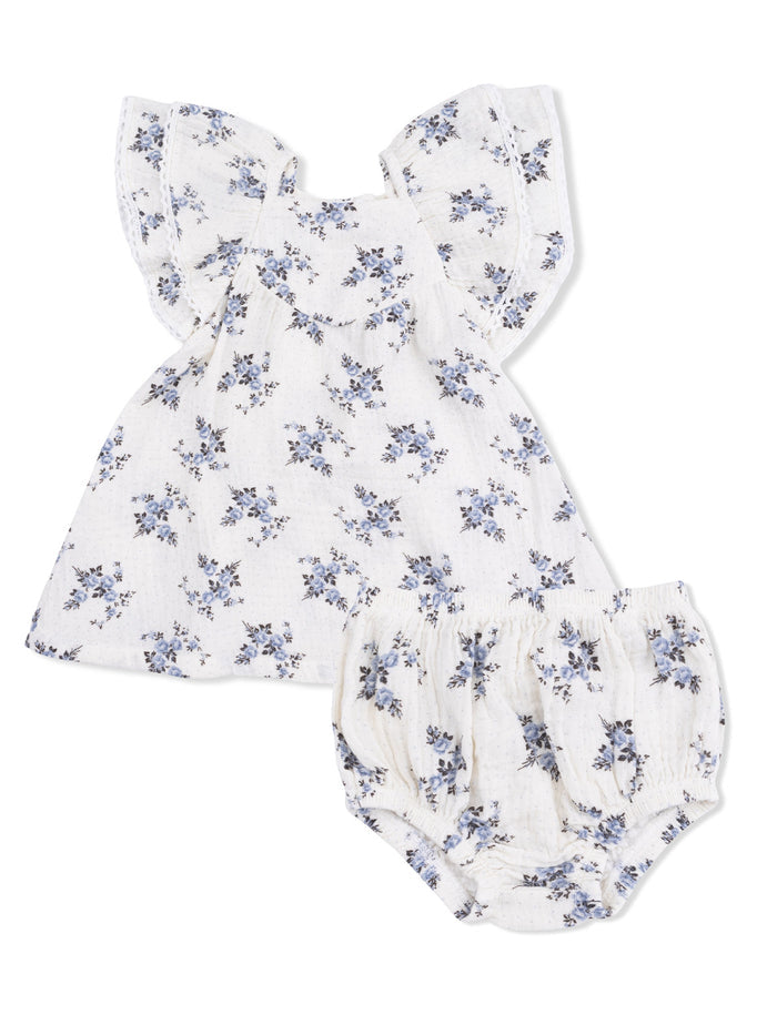 Floral baby outfit with a ruffled top and bloomer shorts in white and blue shades.