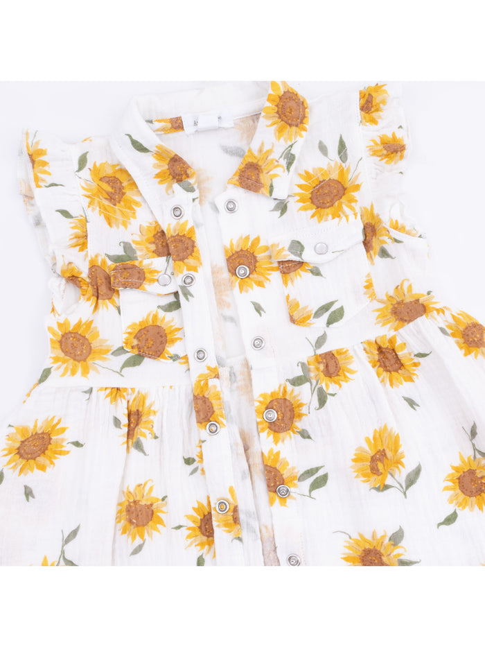 White dress with sunflower pattern, featuring buttons and ruffled sleeves, perfect for warm weather.