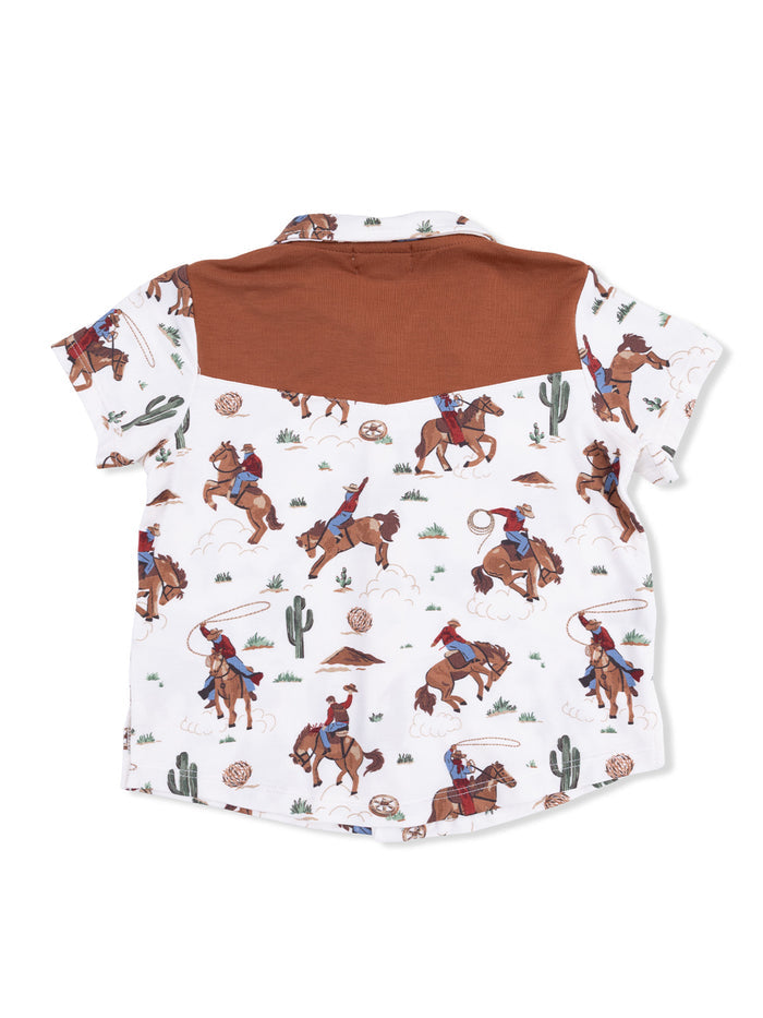 Children's shirt with a brown yoke, featuring a cowboy and horse print against a white background.