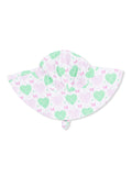 White sun hat with green hearts and pink bows, ideal for kids in sunny weather.