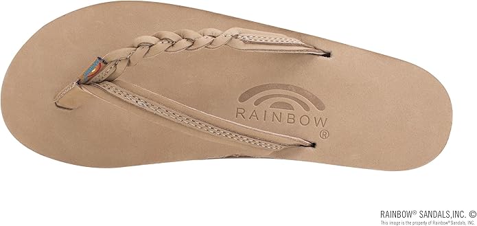 Beige sandal with a brown sole on a white background