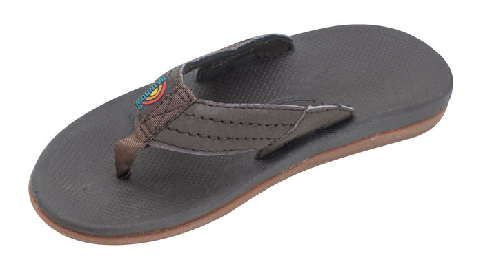 Brown sandal with a colorful strap on a white background
